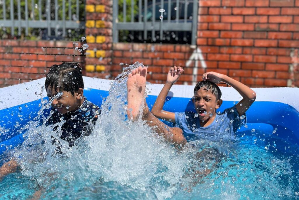 the kids are splashing the water during sensory day