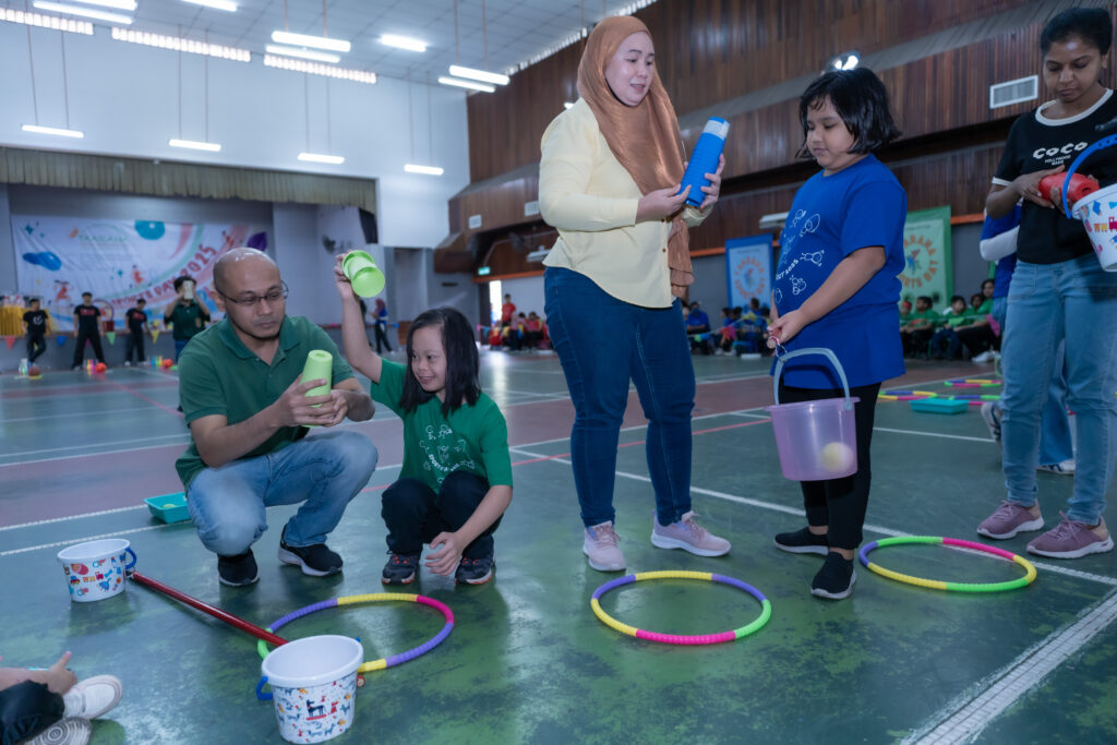 Parents competing with their children during one of the games at Taarana Sports Day